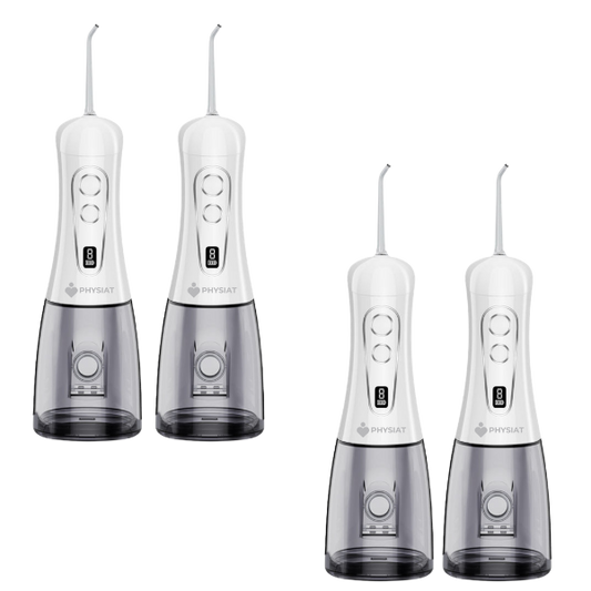Four white and gray dental water flossers on a white background